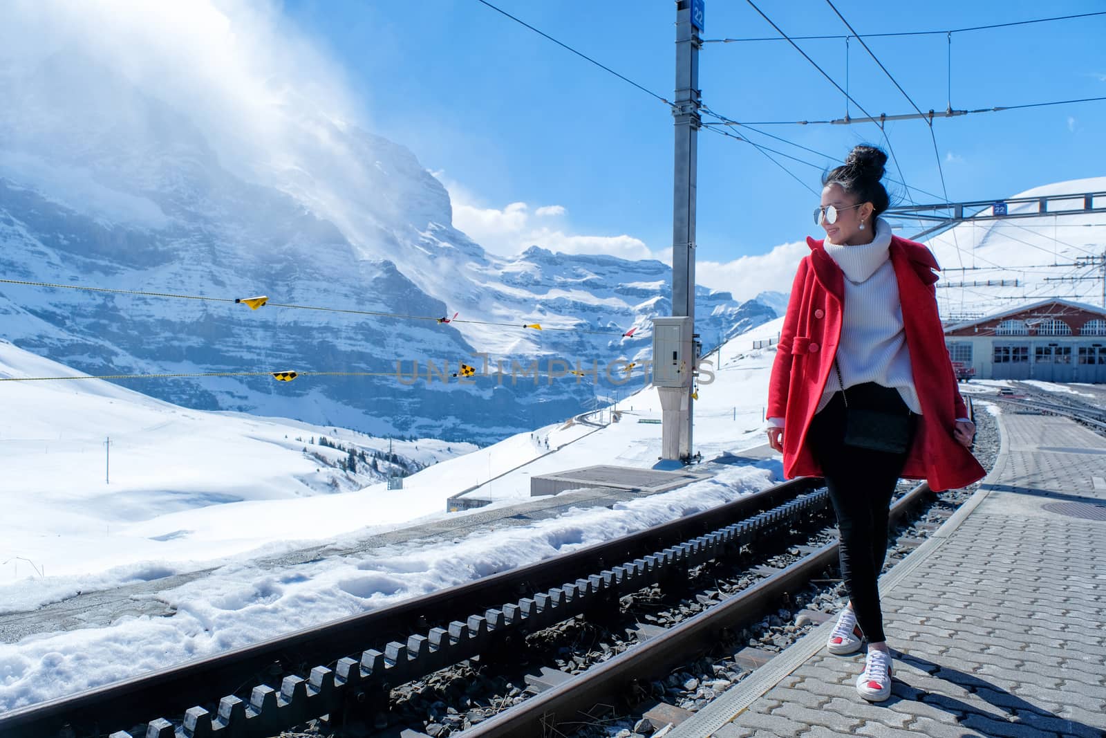 Asian woman in train station, Switzerland