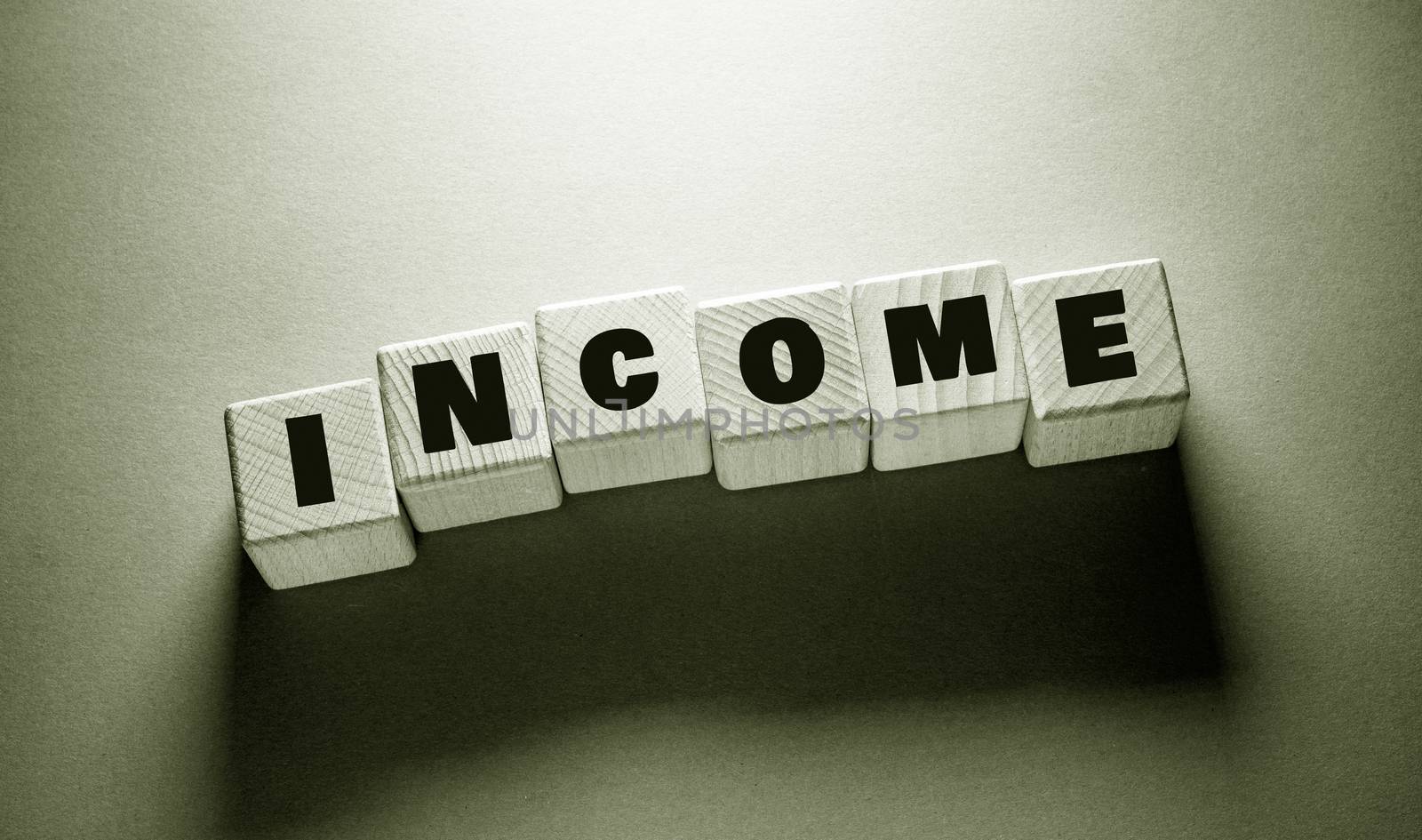 Income Word with Wooden Cubes by Jievani