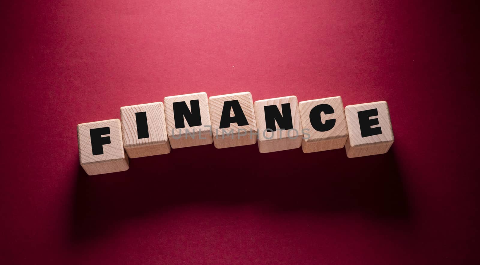 Finance Word with Wooden Cubes by Jievani