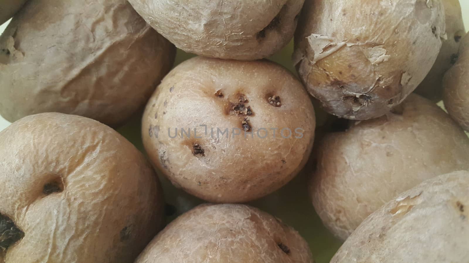  close up view of fresh organic potato in market:  Food background texture of raw potatoes