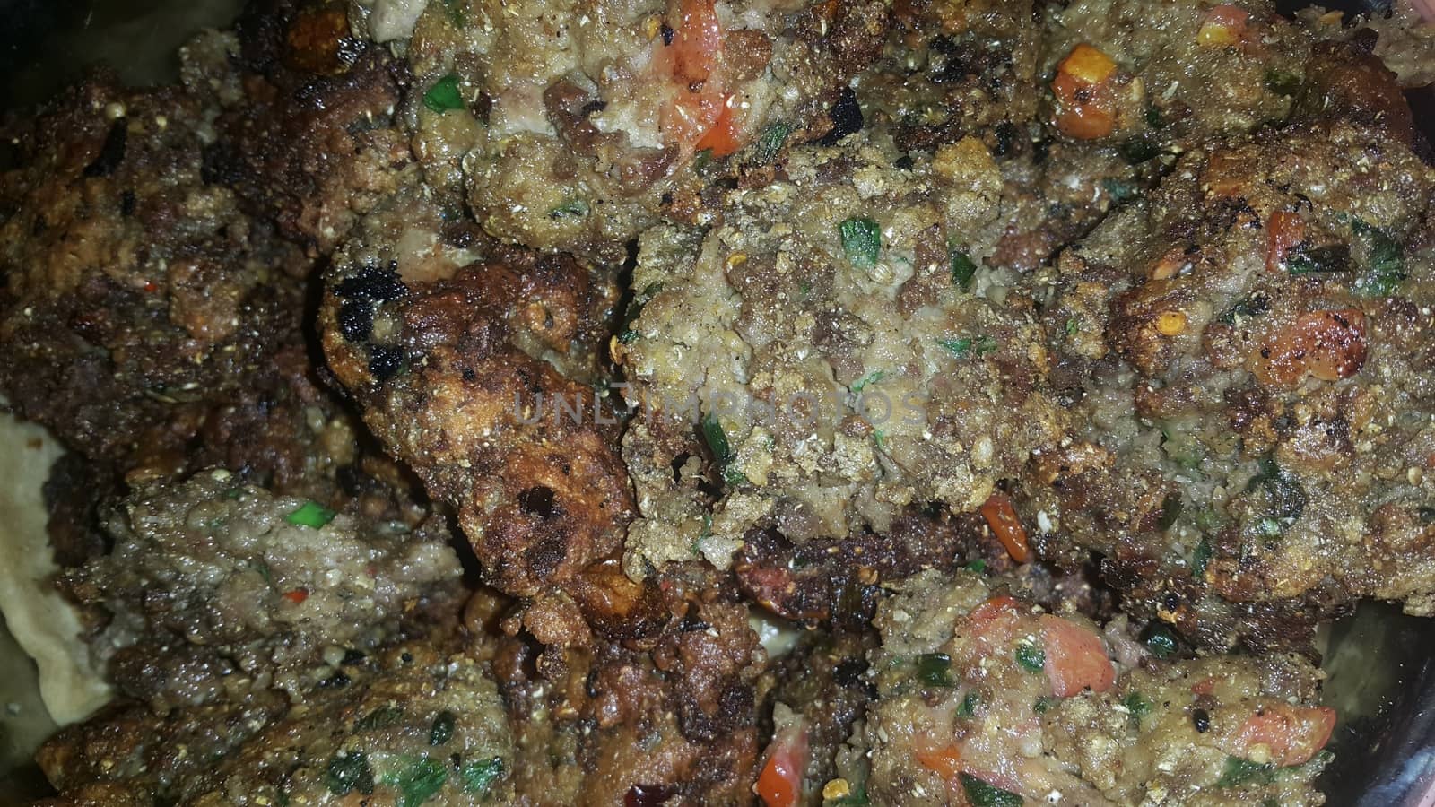 Closeup view with selective focus on delicious spicy fried round kebab served in a ceramic plate