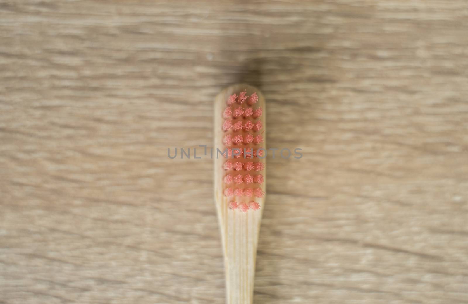 Eco-friendly bamboo toothbrush on a table. Zero-waste. Biodegradable toothbrush. by vovsht