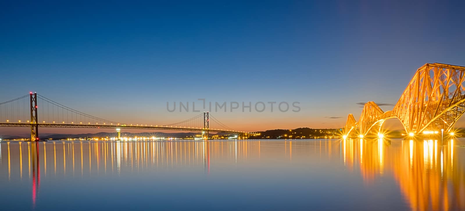 Panorama of the two bridges over the Firth of Forth in Scotland at dawn