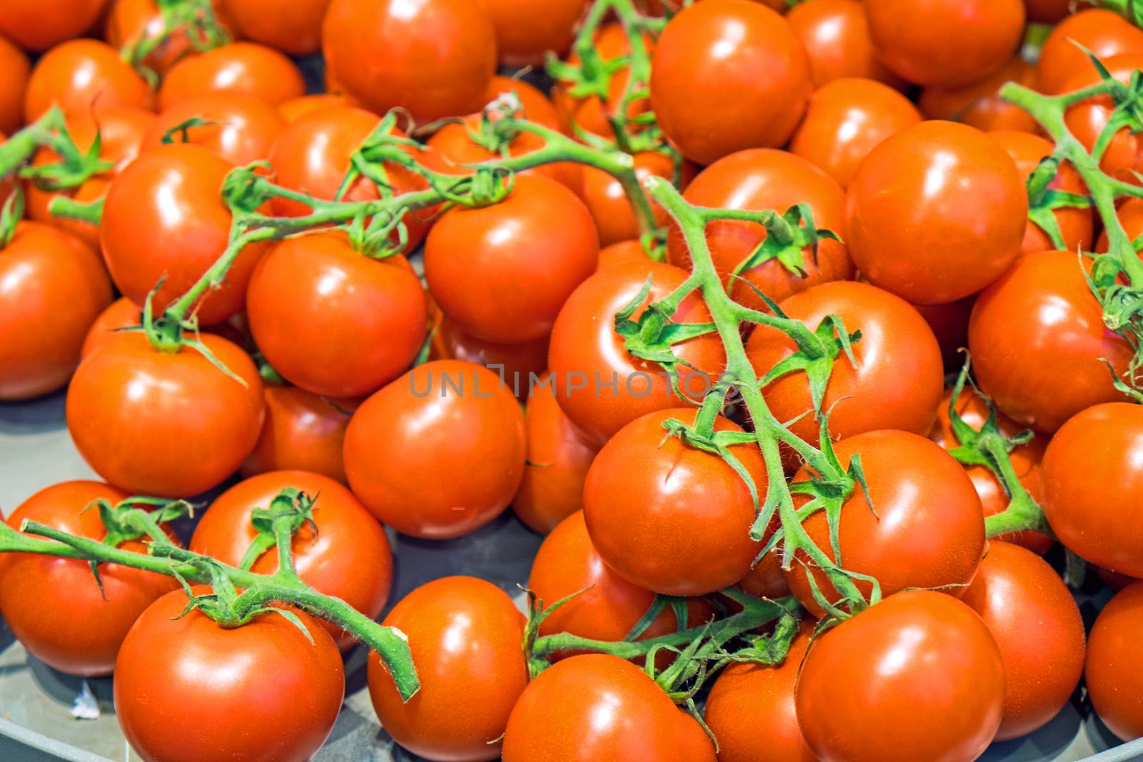 Red ripe tomatoes for sale at a market