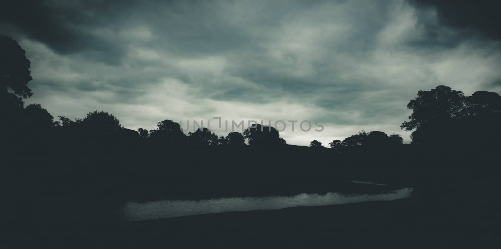 dark moody evening by the River Bela at Dallam Park, Milnthorpe, Cumbria, England