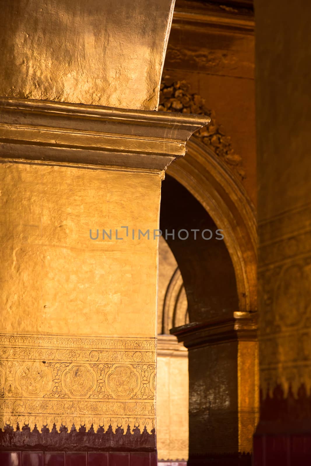 The Mahamuni Buddha Temple, Mandalay, Myanmar(Burma)12/12/2015 interiors. The Mahamuni Buddha Temple, a Buddhist temple and major pilgrimage site, red and golden wall High quality photo