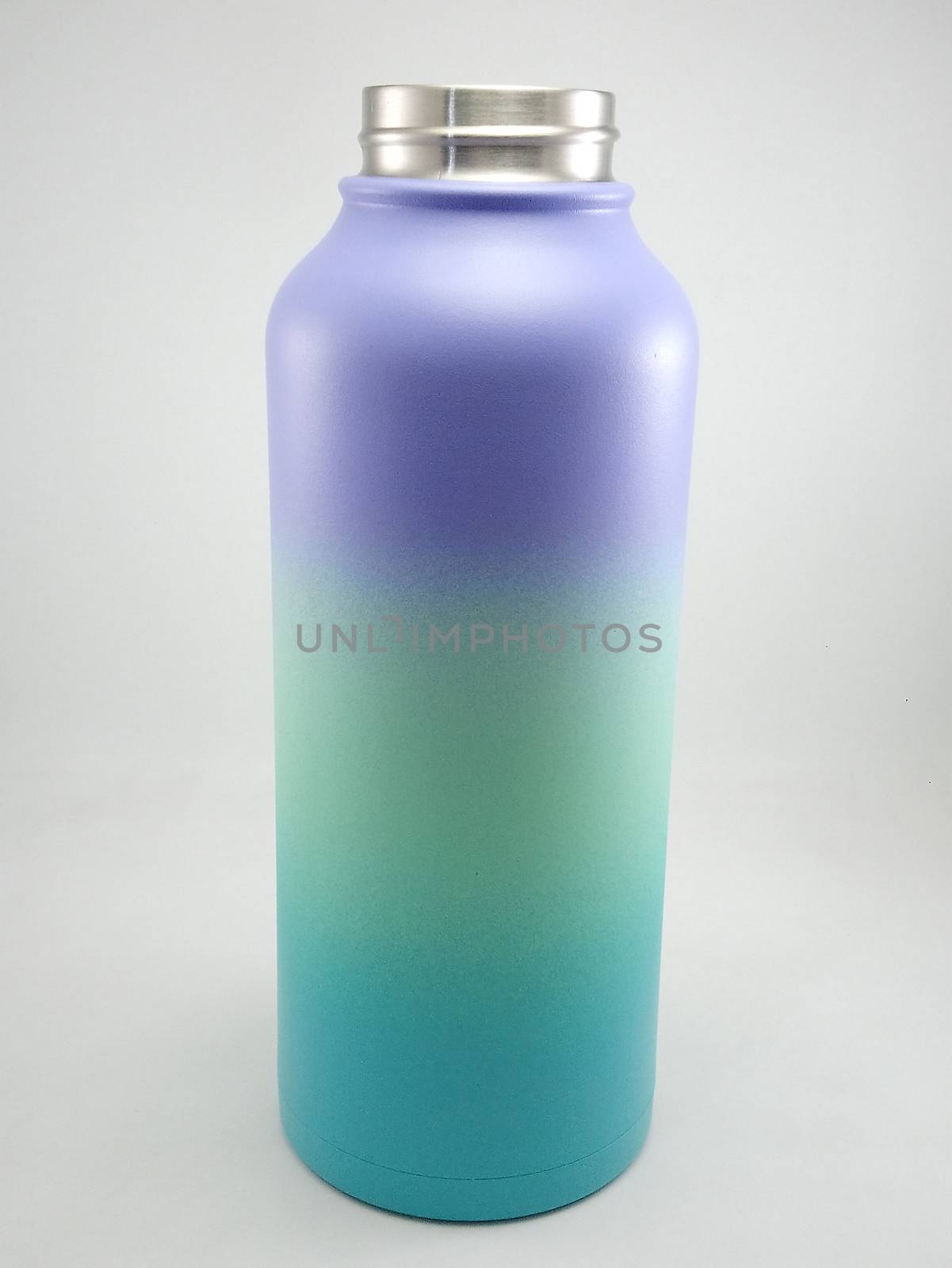 Colorful metal water canister use to pour liquid content for drinking