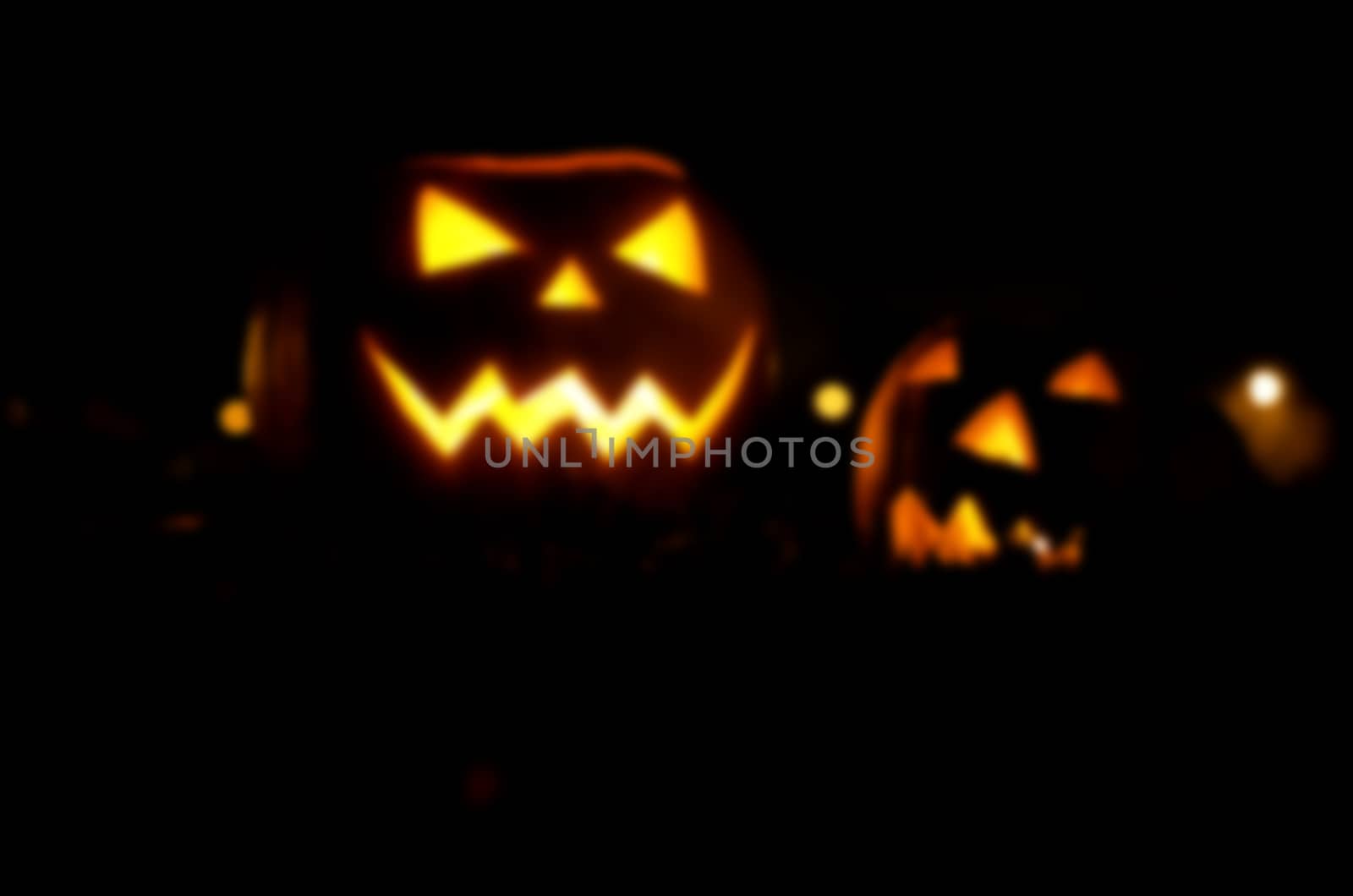 Frightful ghost face glowing on Halloween in the darkness, blur. by KajaNi