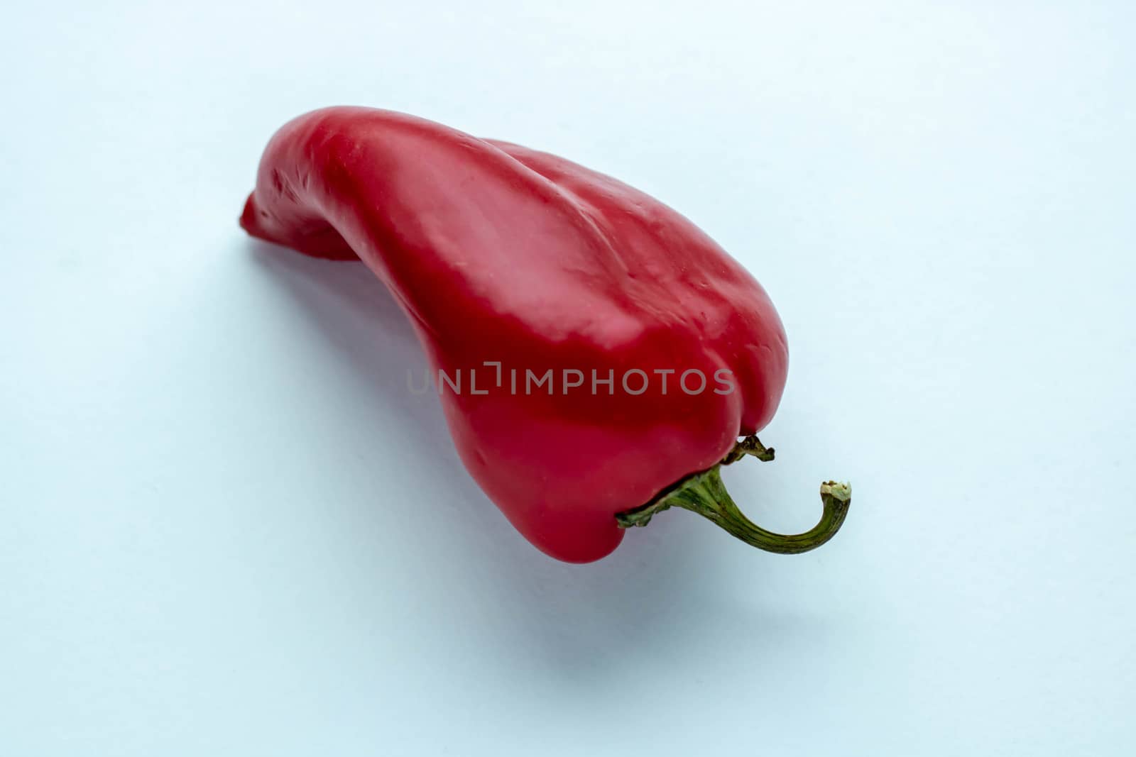 Red hot pepper on white background. Vibrant color by lapushka62