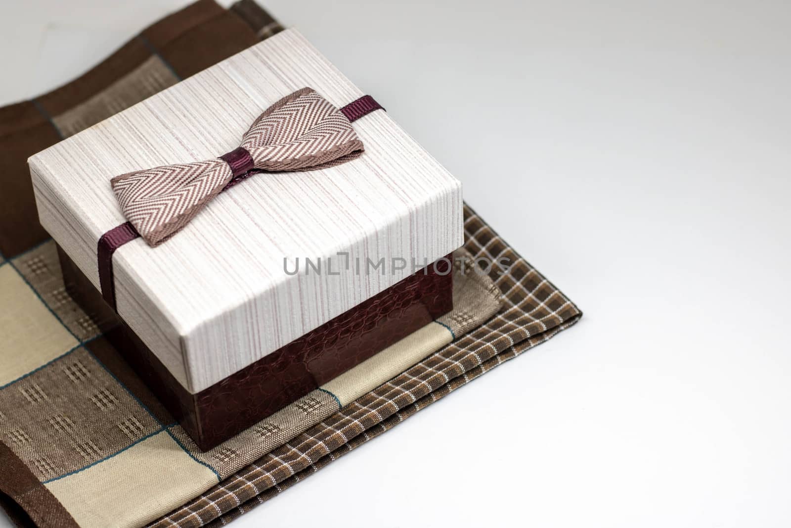 box with filling material inside. Empty natural box with decorative straw for happy gifts isolate on white background