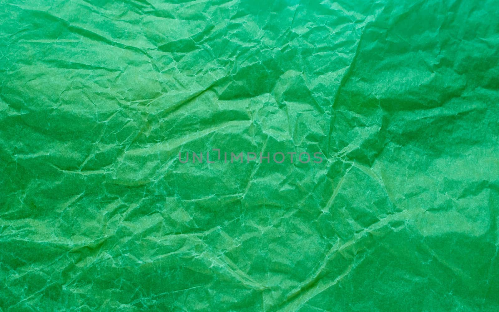 Rumpled paper texture green. Texture of crumpled paper. Crumpled paper. Wrinkles paper.