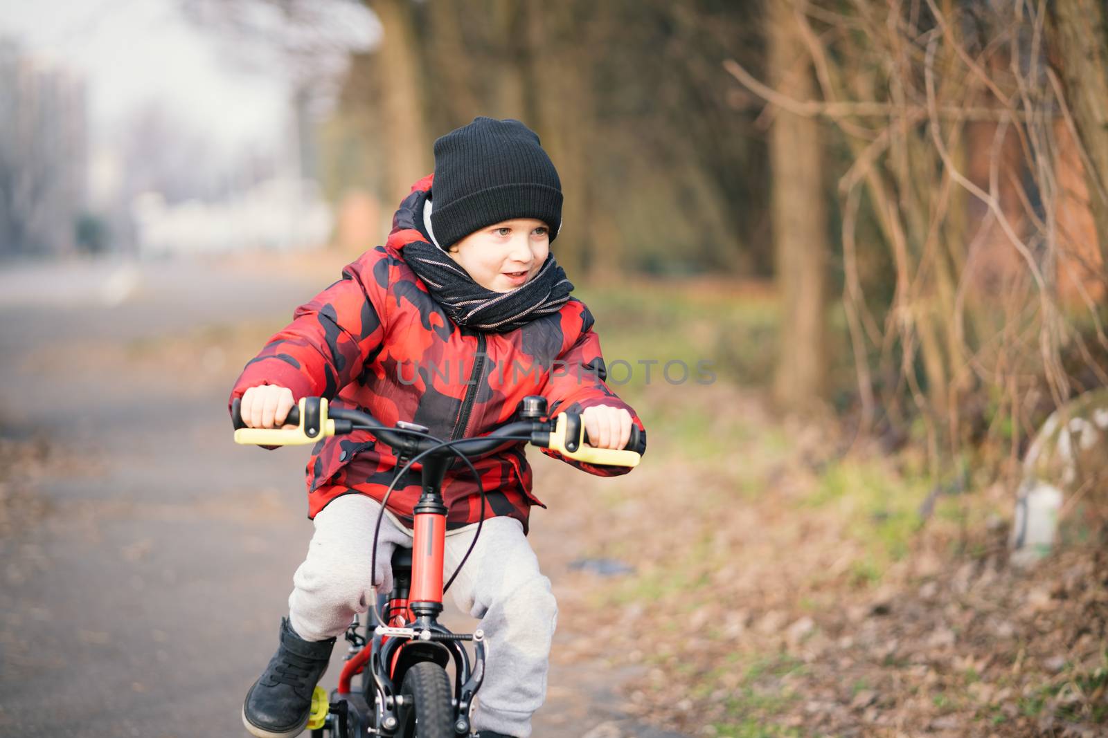 Kid boy riding bicycle in the park by Robertobinetti70