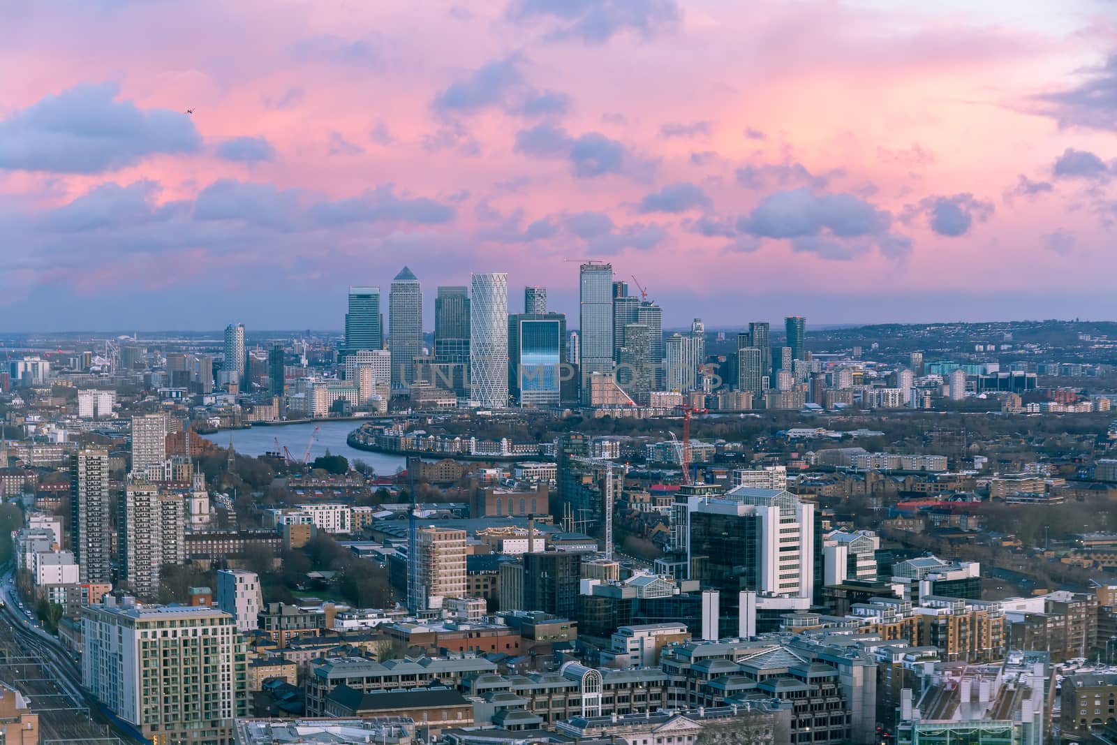 Aerial sunset cityscape of River Thames with Canary Wharf in the background by magicbones