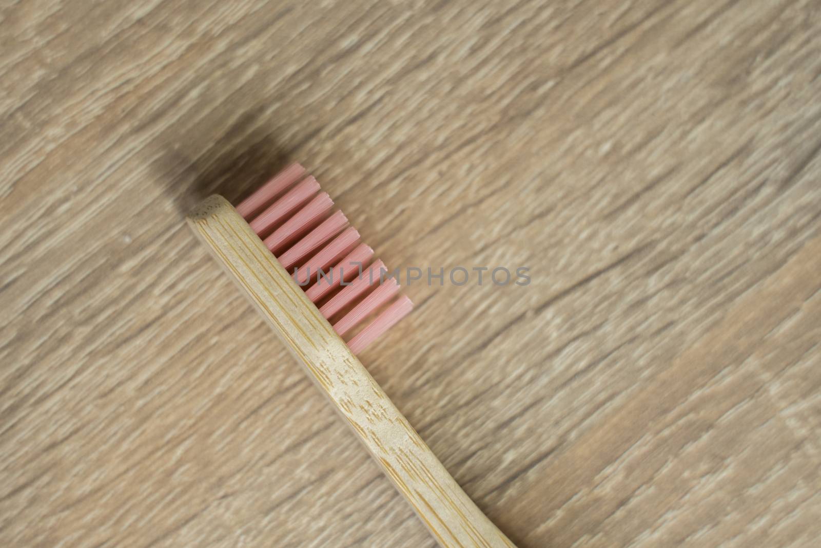 Eco-friendly bamboo toothbrush on a table. Zero-waste. Biodegradable toothbrush