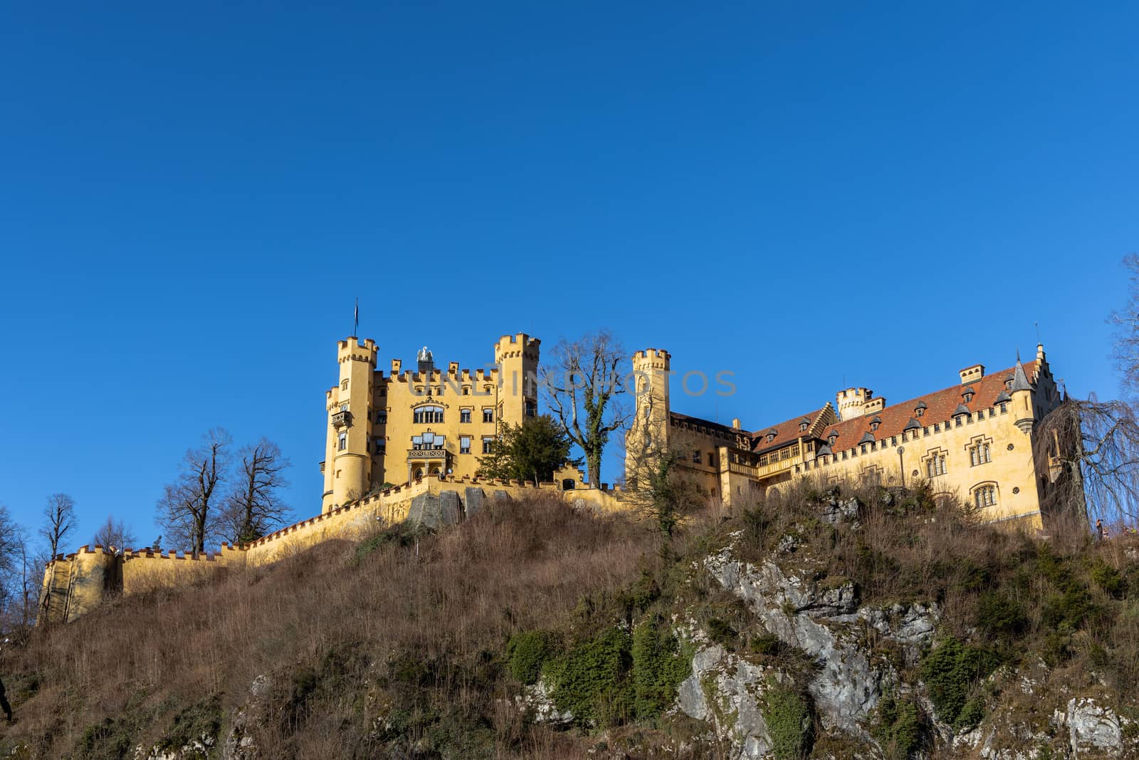 Beautiful view of the famous Hohenschwangau Castle on a sunny day in winter, Schwangau, Bavaria, Germany