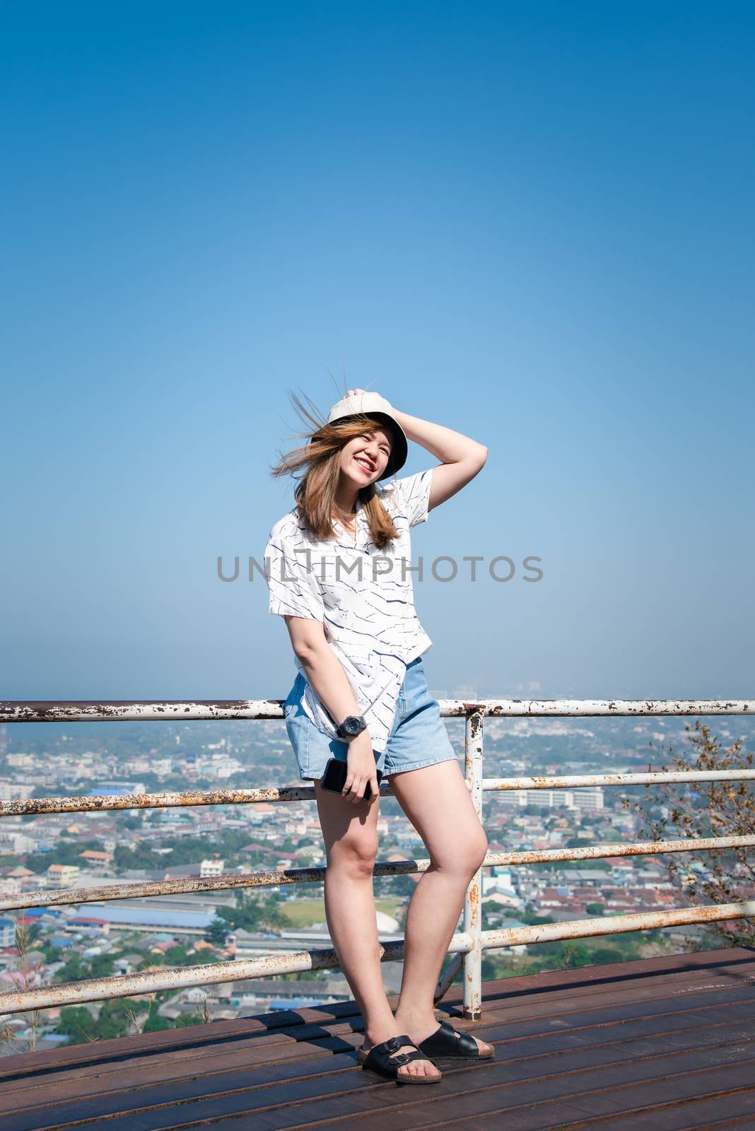 Woman relax at landscape viewpoint on mountain by PongMoji