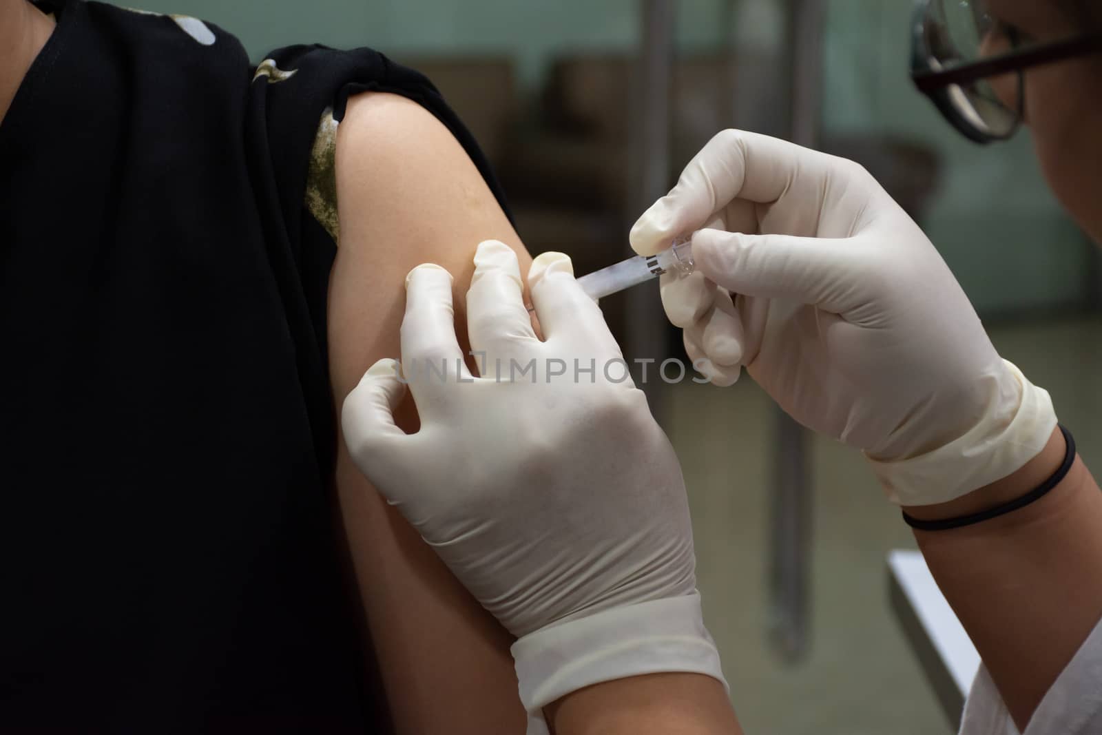 Patient asian woman get vaccinated the flu covid19 by PongMoji