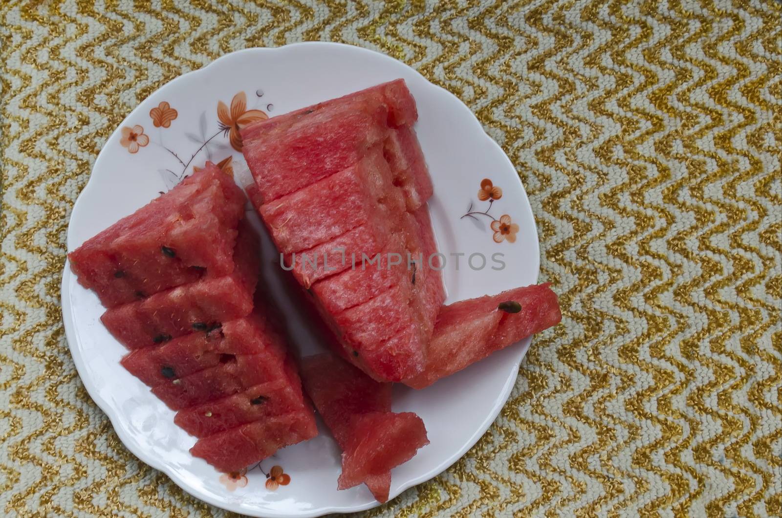 Slices of juicy watermelon arranged on a plate by vili45