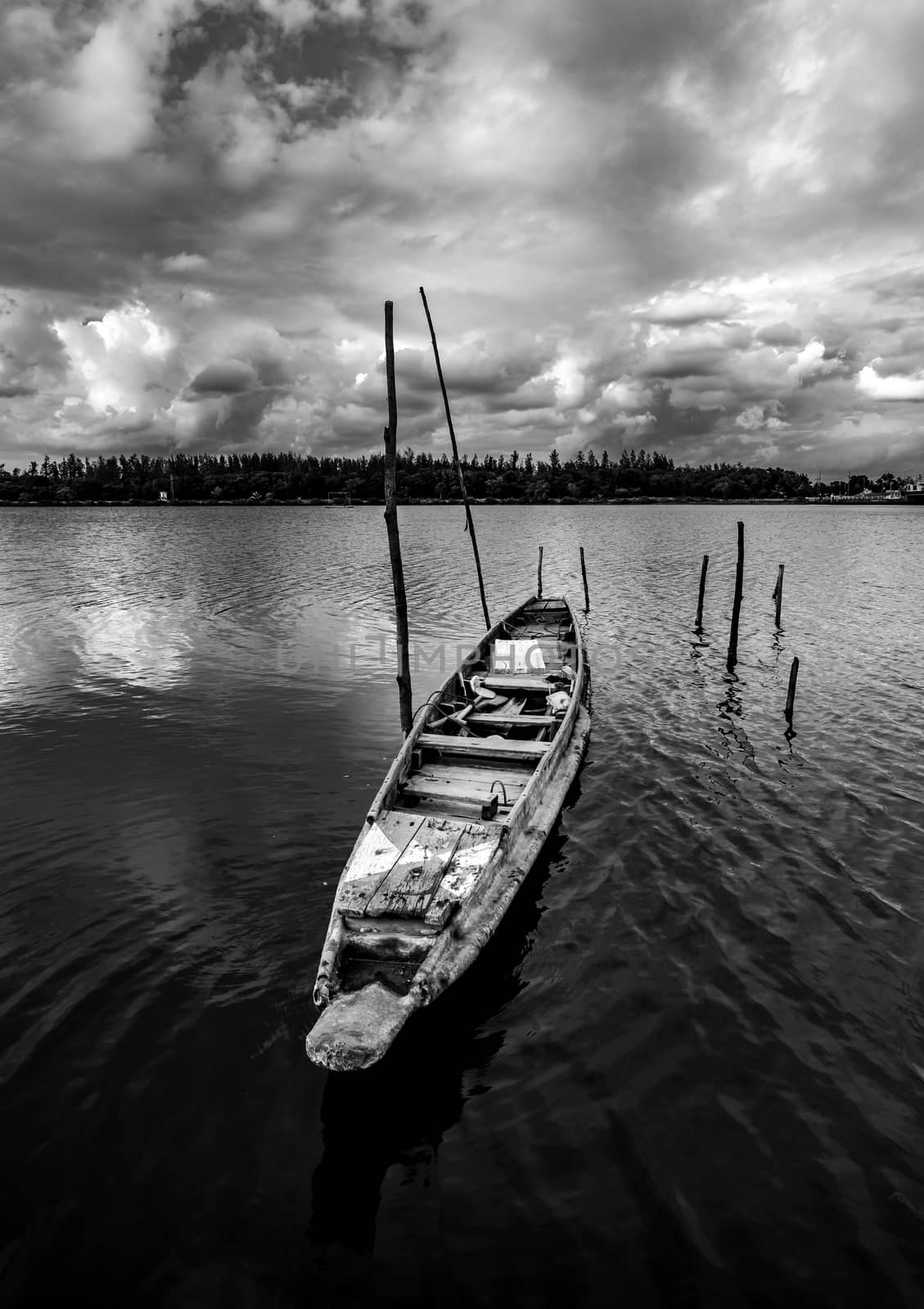 Fishing boat with view of landscape nature in sky and cloud storm and river in stormy rain season, Black and white and monochrome style