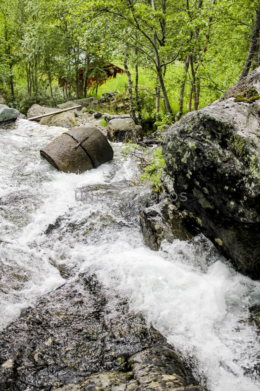 Flowing waterfall river Lake Hemsila in Hemsedal, Norway. by Arkadij