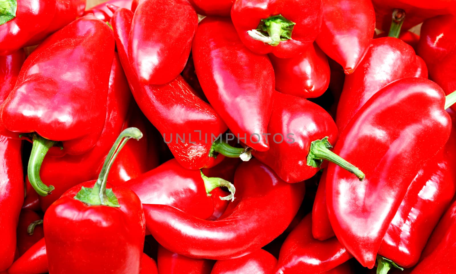 Pile of sweet red peppers, selective focus. by Sergii
