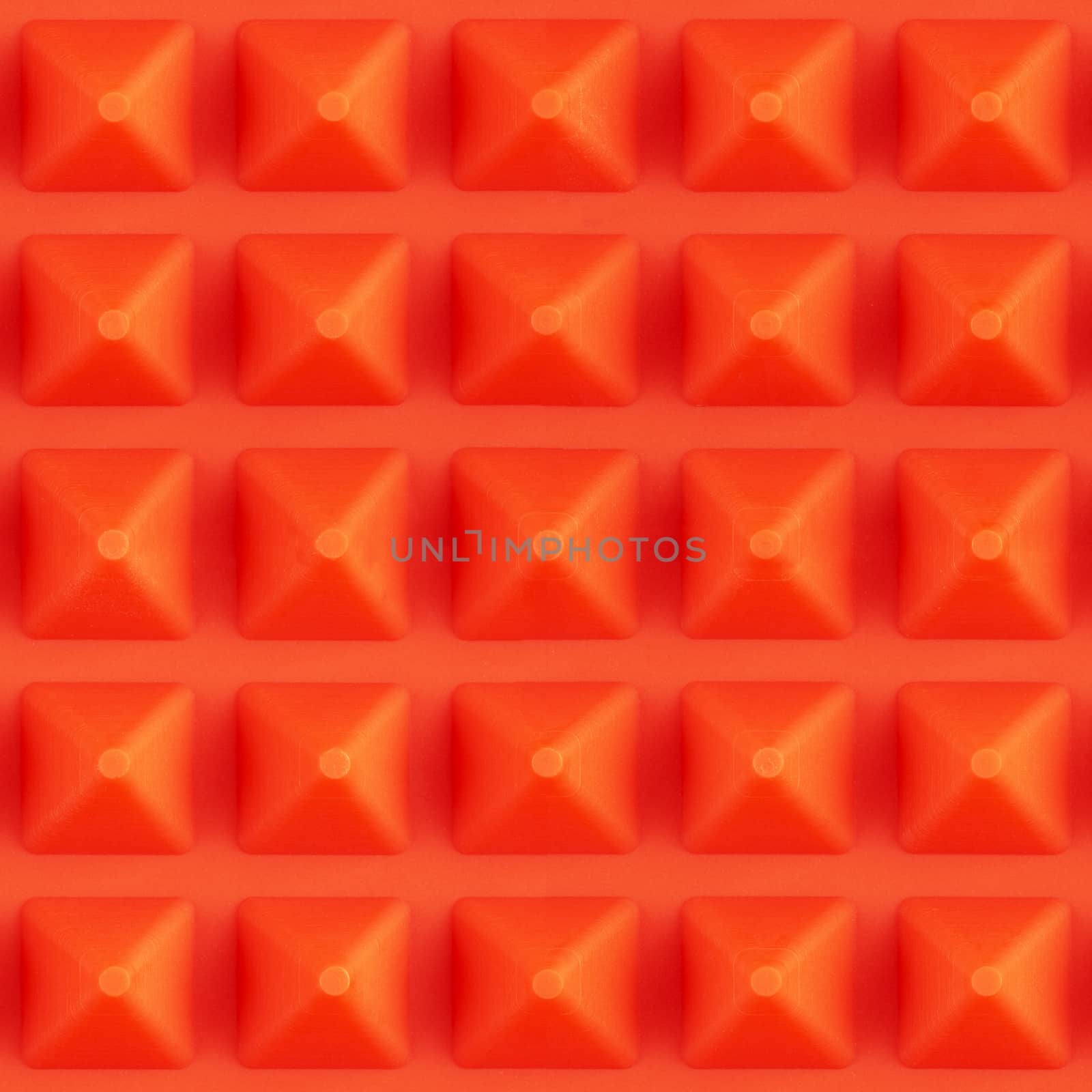 seamless square texture of red silicone pyramidal cooking mat.