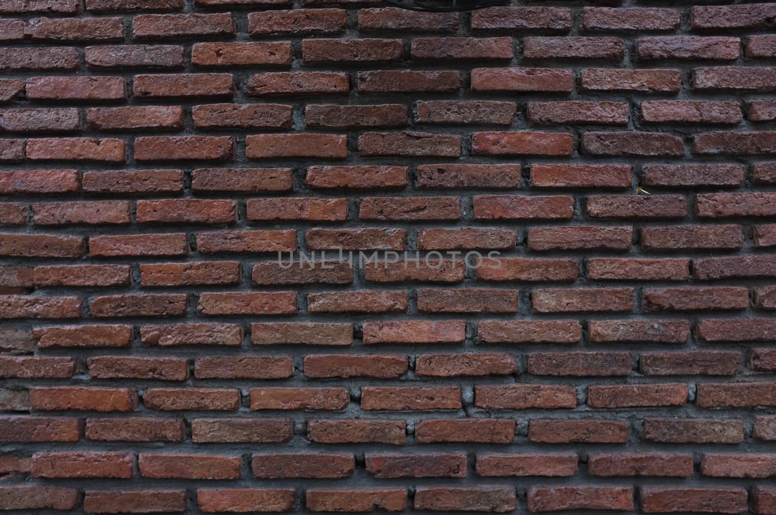 Brick red wall. background of a old brick house.