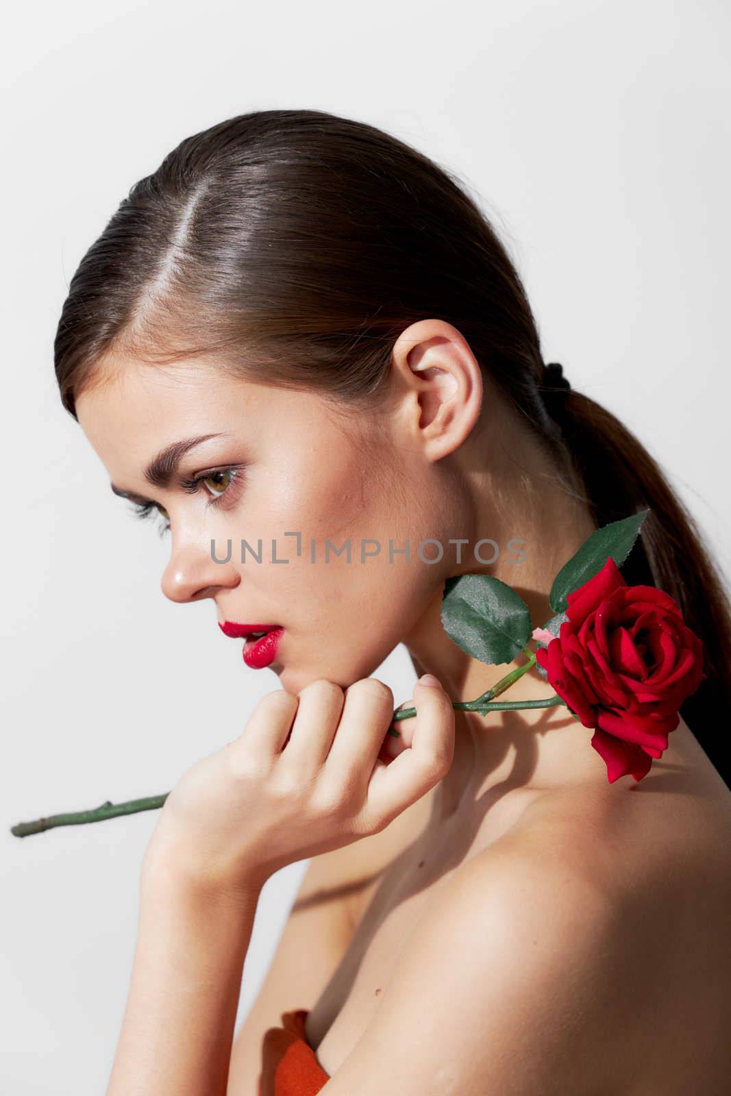 Lady with rose Bared shoulders red lips side view cute face cropped view