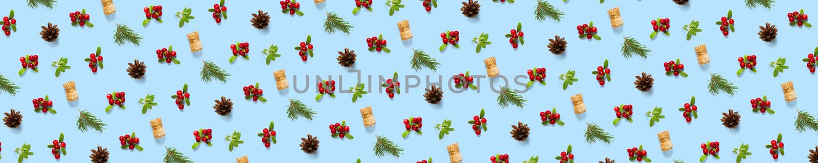 christmas background with pine cone, wine cork, pine twig and lingonberry. christmas background on blue backdrop. by PhotoTime