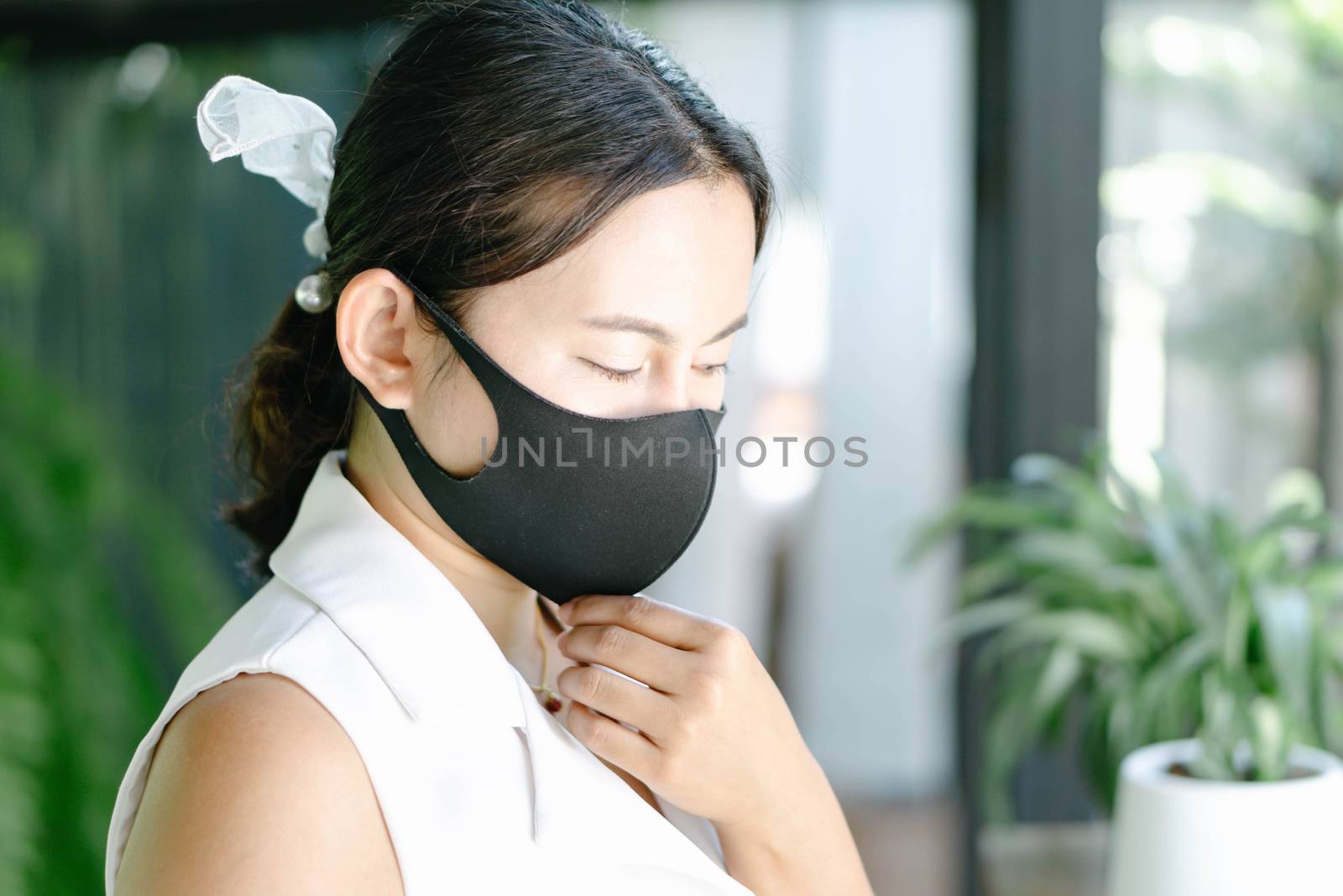 Closeup woman wearing face mask for protect air polution or viru by pt.pongsak@gmail.com