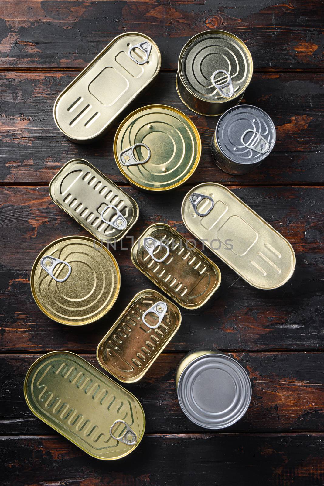 Tin cans food set top view on dark wood rustic background top view by Ilianesolenyi