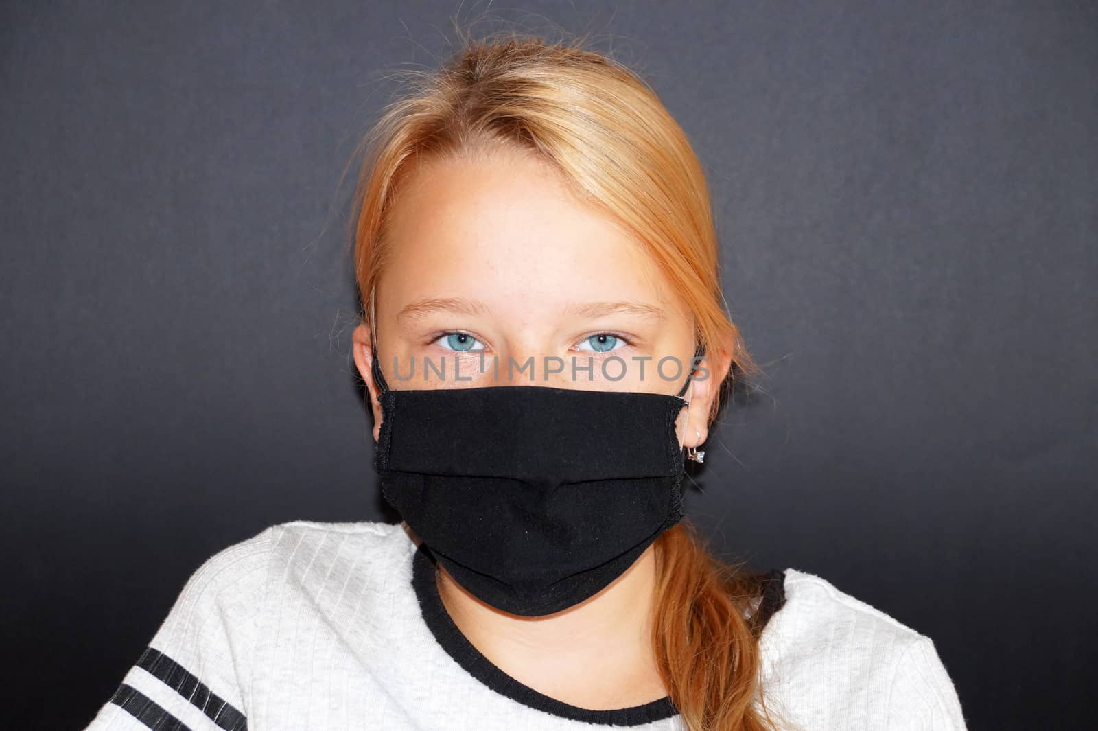 teenage girl in a black medical mask on a black background, portrait by Annado