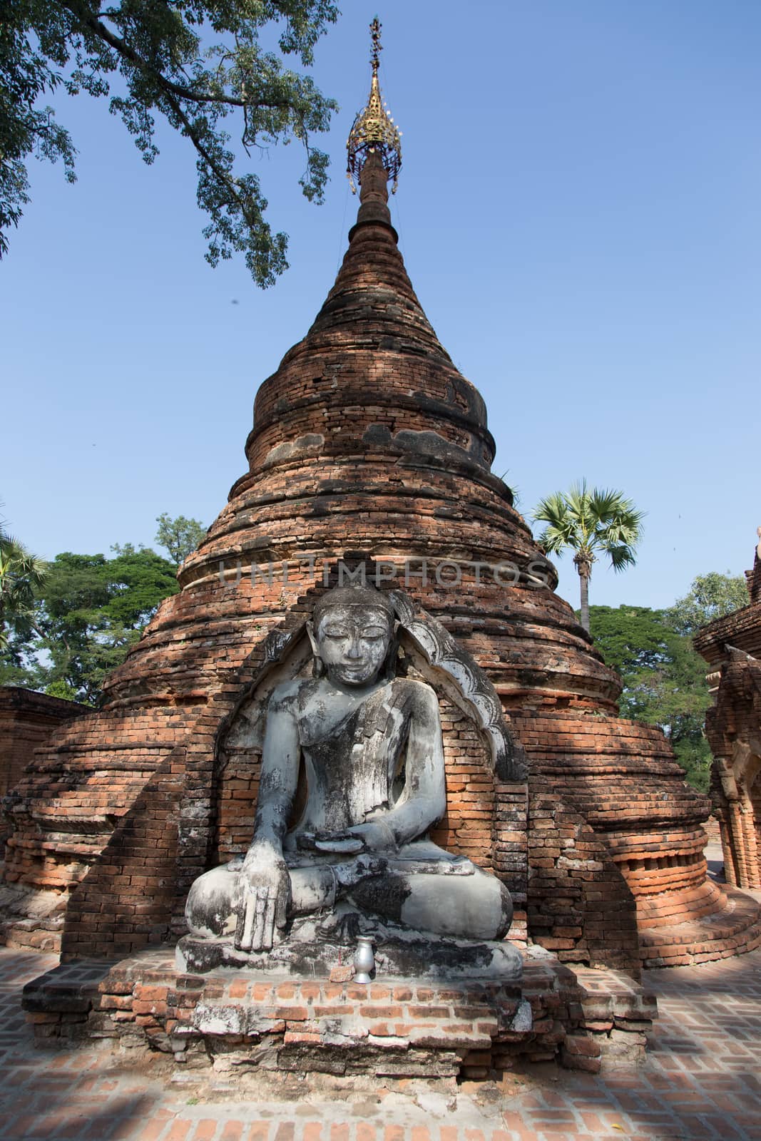 Inwa Island, Mandalay, Myanmar, stupa and temple in landscape reflected in water. Pagoda on Inwa island at Ayeyarwady River near Amarapura, Myanmar, Burma High quality photo