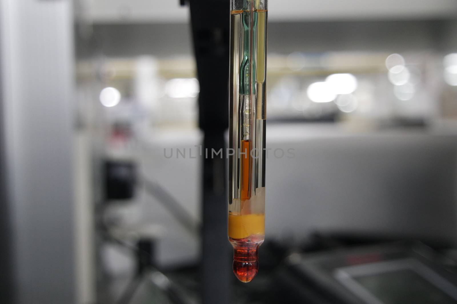 Close-up view of pH meter, a device for measuring pH with equipment for analysis of solutions quality in a chemical laboratory