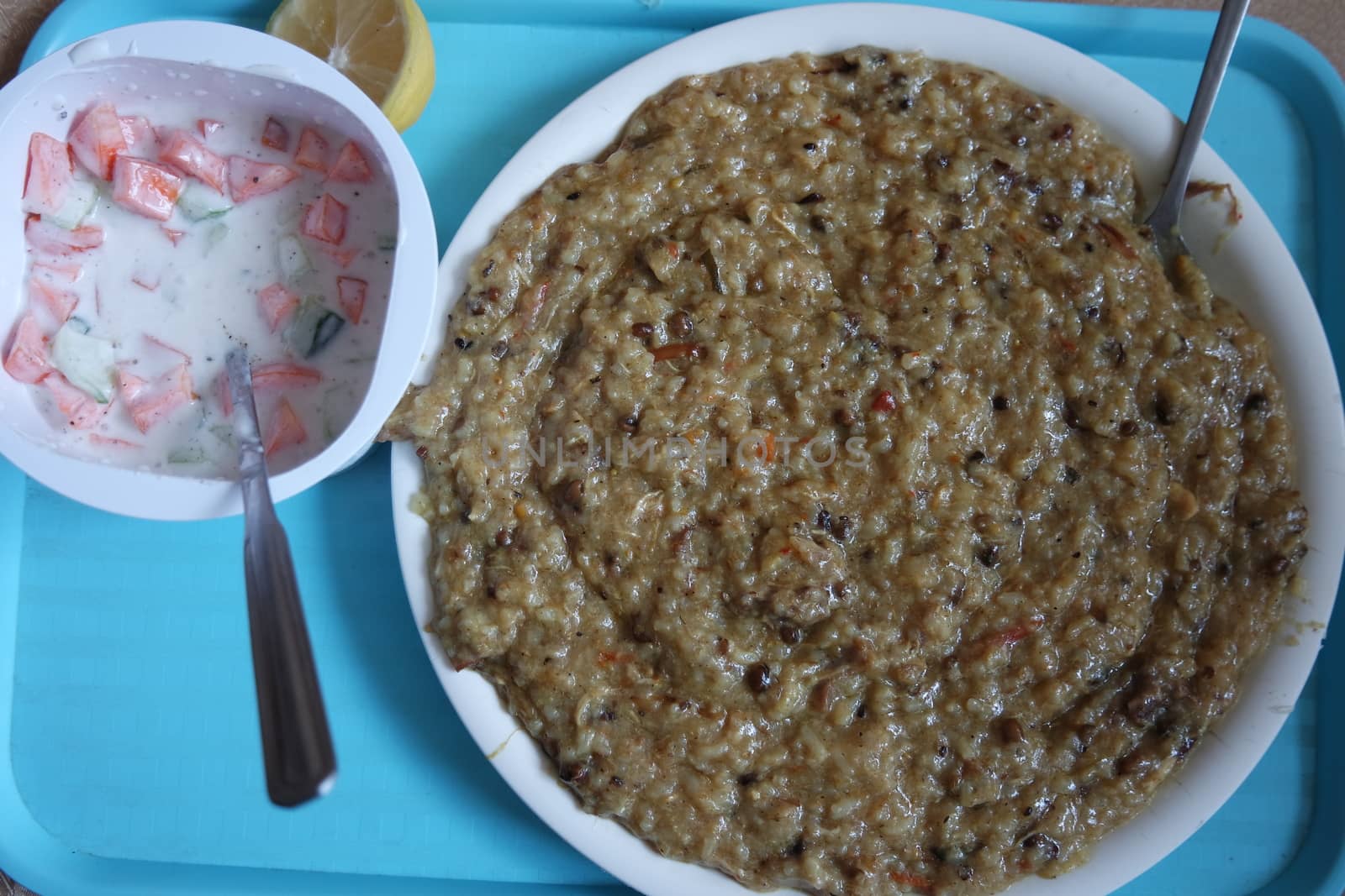 A close up view of Cooked white rice called Kichra served with green mint with traditional Charsadda recipe popular for its delicious taste in Pakistan