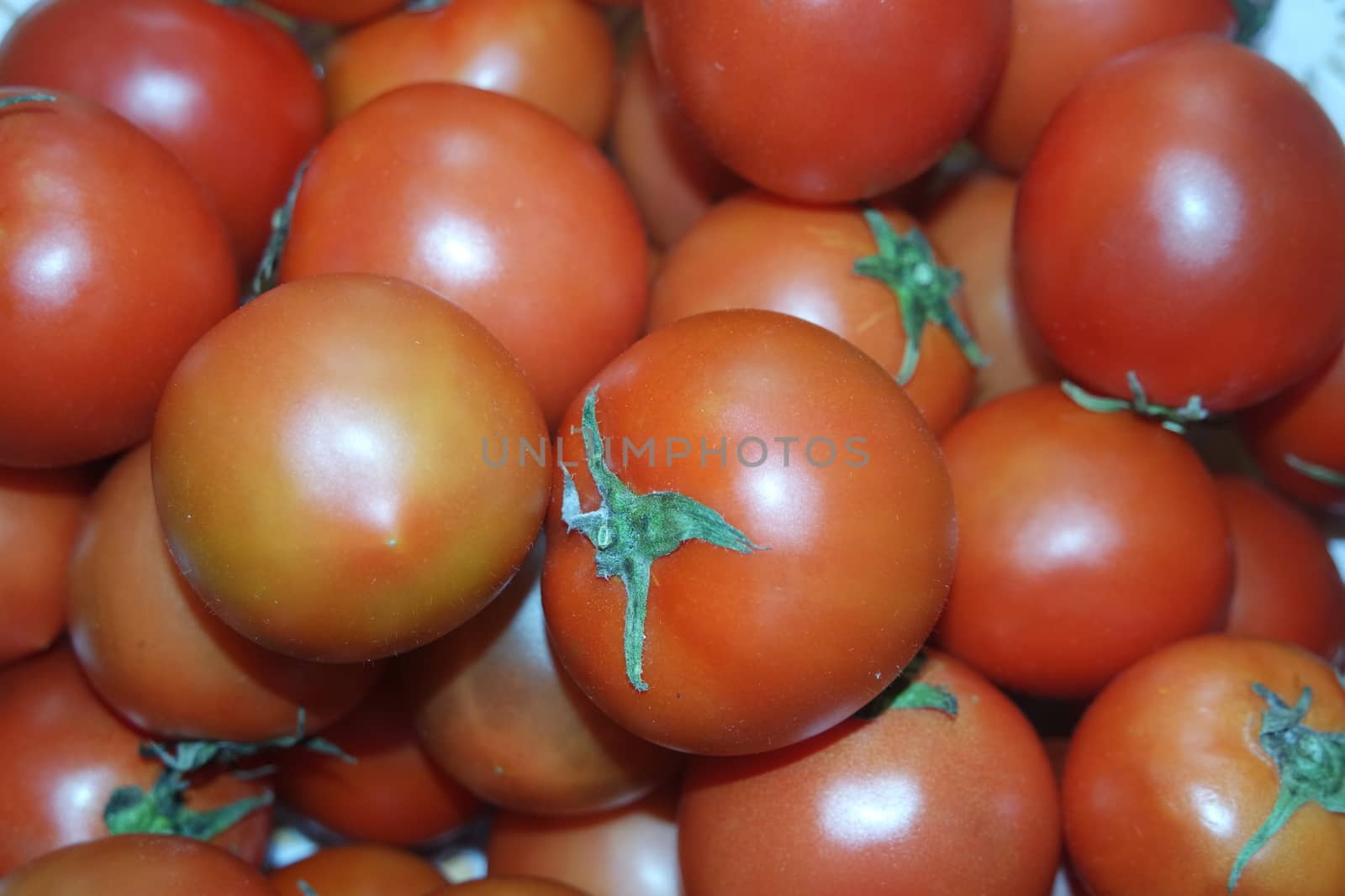 Close-up view of red tomatoes in market for sale. A fruit background for text and advertisements