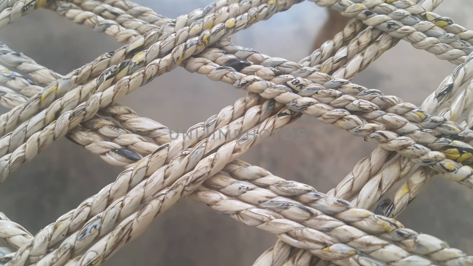 Closeup view of dried jute thread or ropes interwoven for making traditional old style bed called charpai