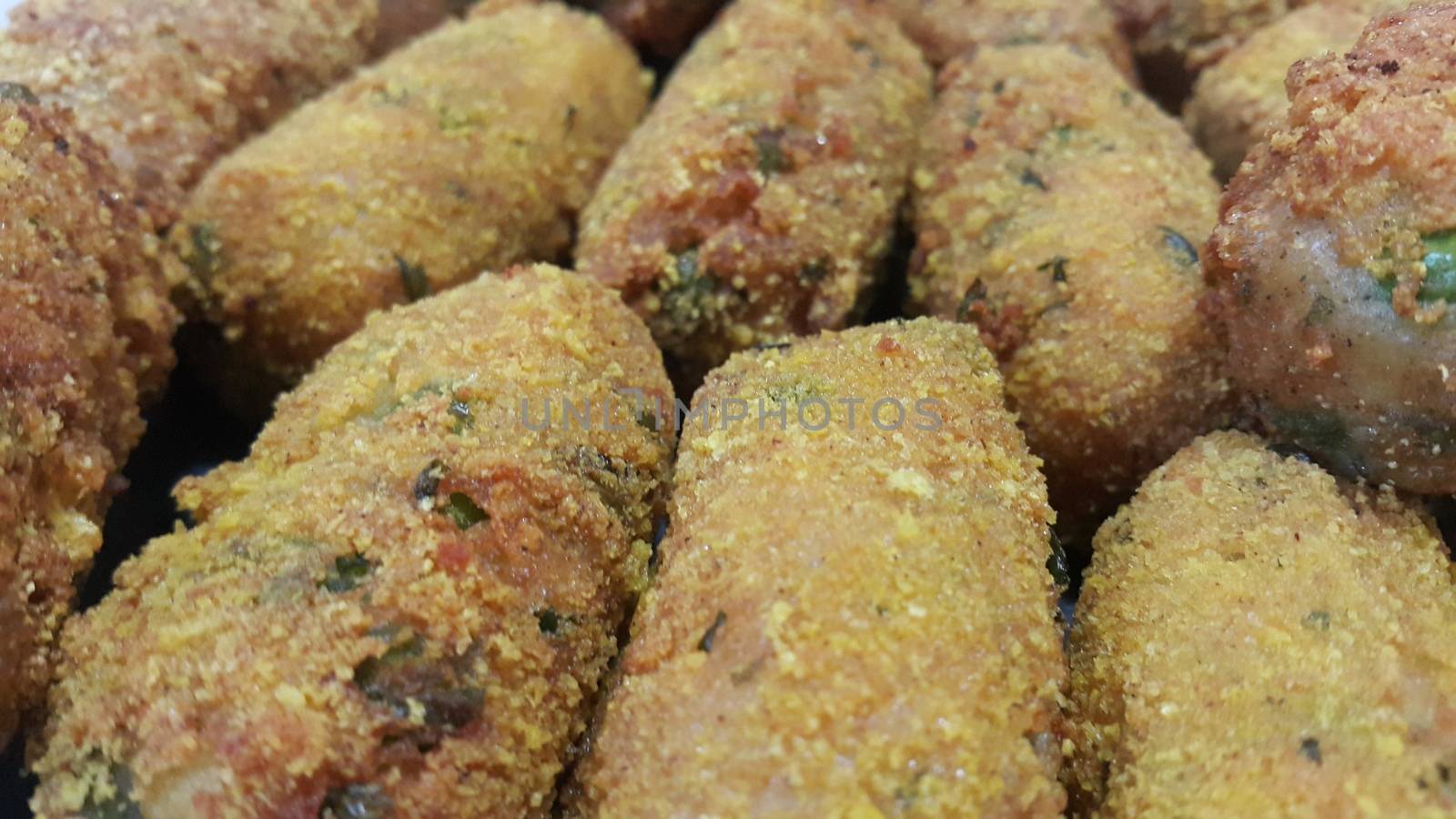 Closeup perspective view of home made spicy and delicious croquettes served with tea or other dishes during parties as fast food.