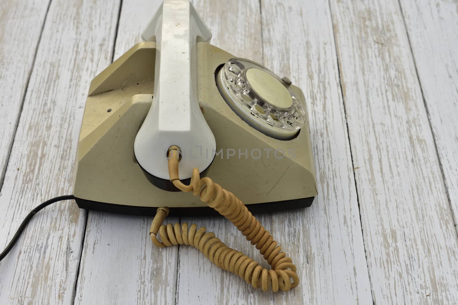 old rotary dial phone, side view