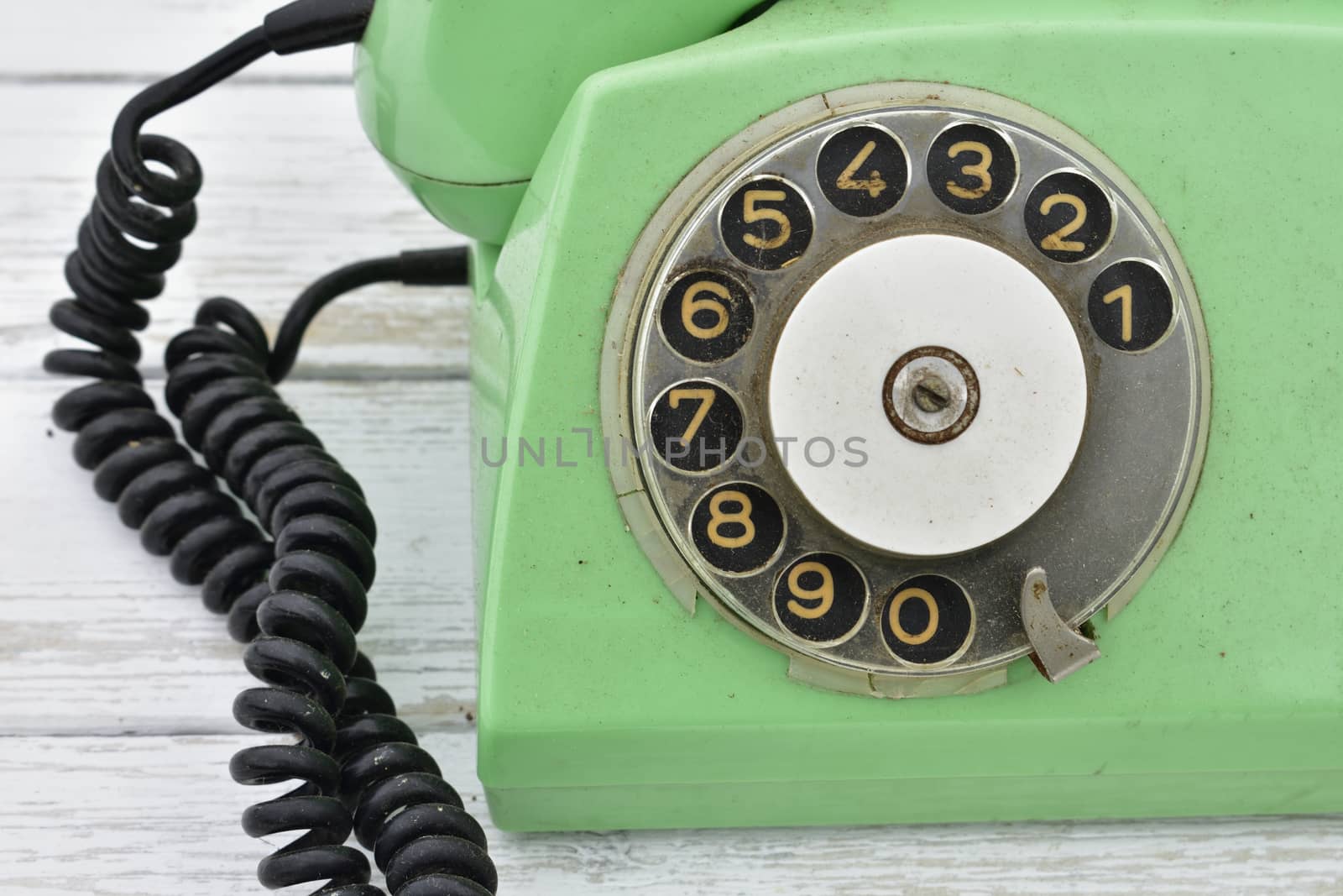old rotary dial phone, green color