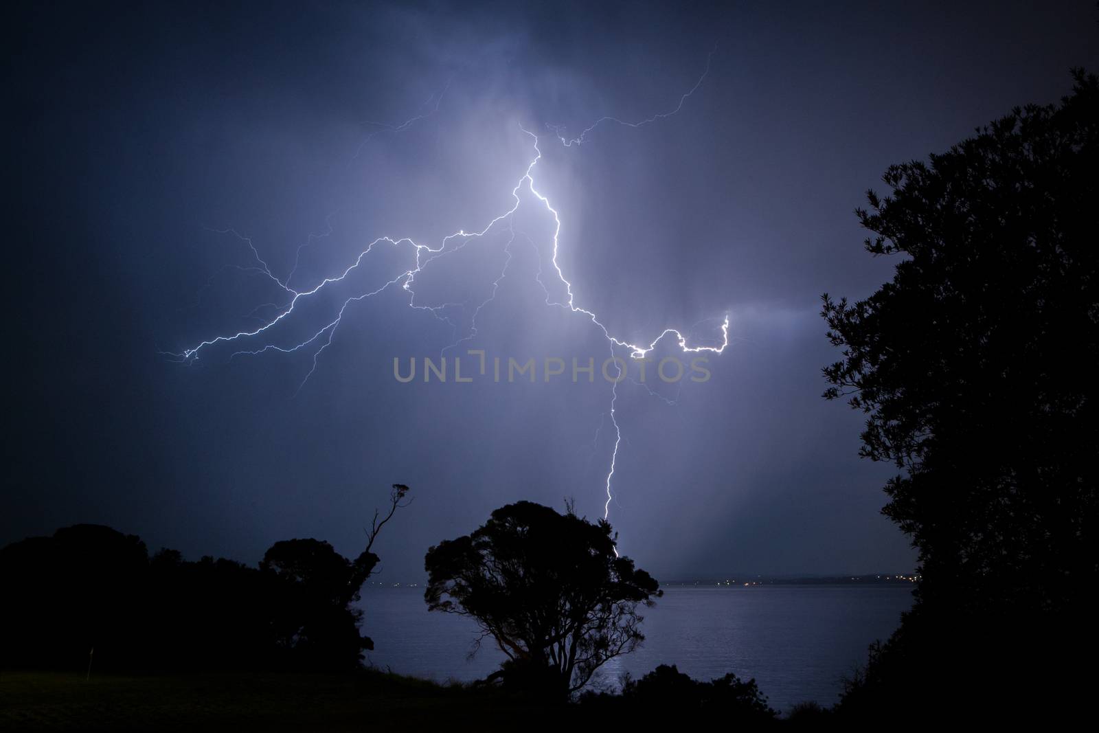 Bolts of lightning hit the ground during a heavy storm in Cowes, Phillip Island, Victoria, Australia