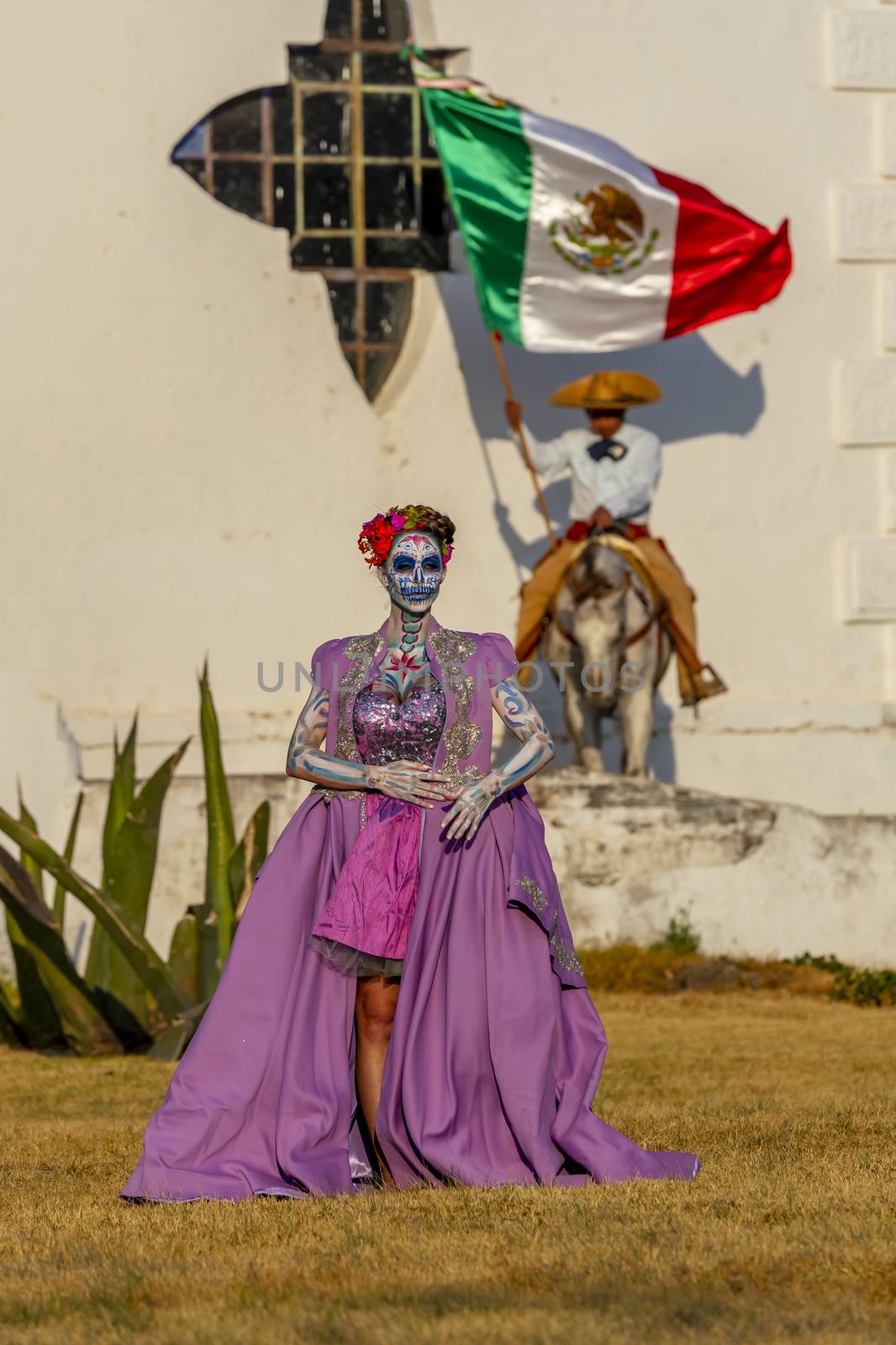 A Lovely Hispanic Brunette Model Poses With Traditional Paint For A Mexican Festival by actionsports