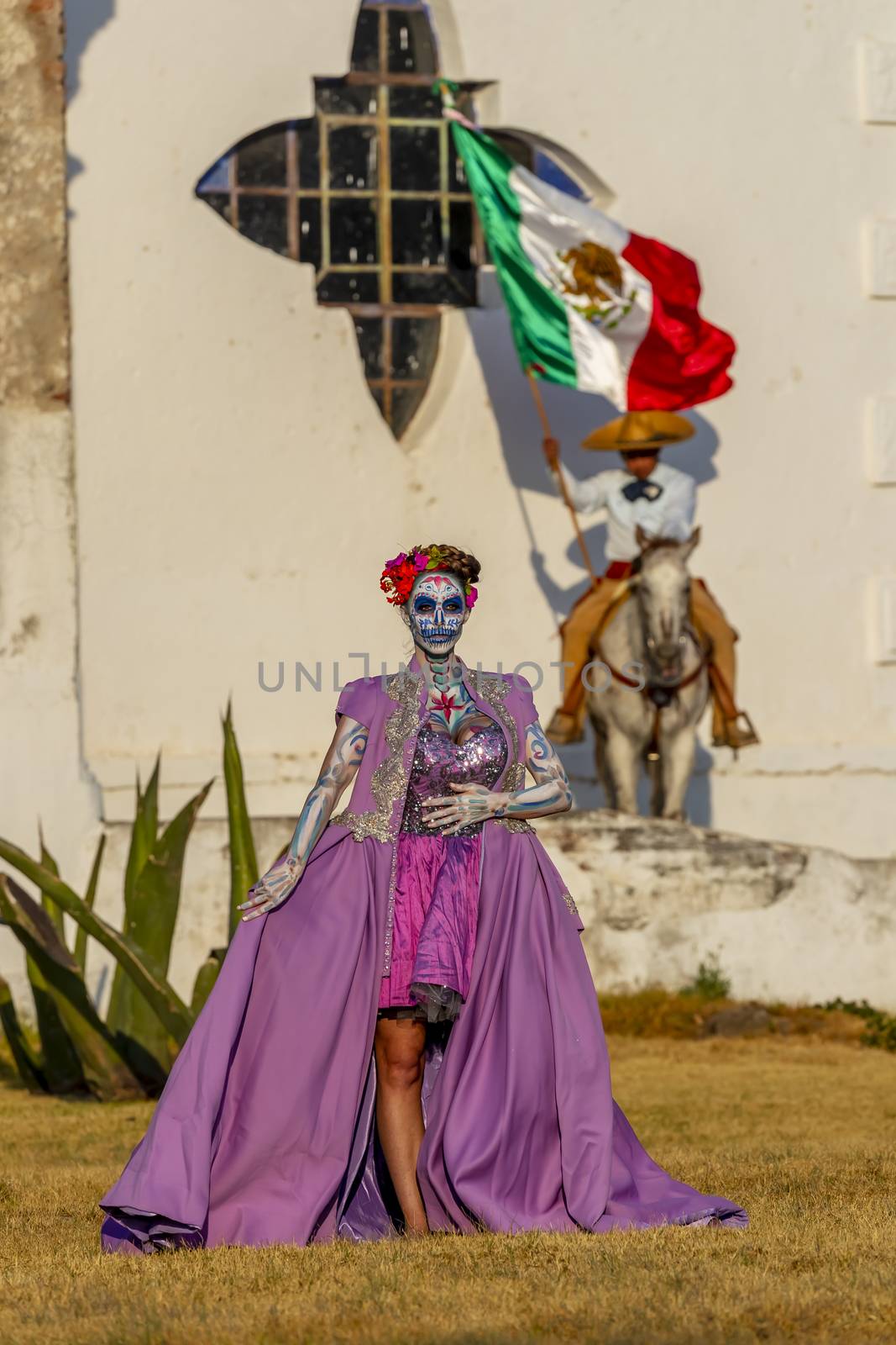 A Lovely Hispanic Brunette Model Poses With Traditional Paint For A Mexican Festival by actionsports