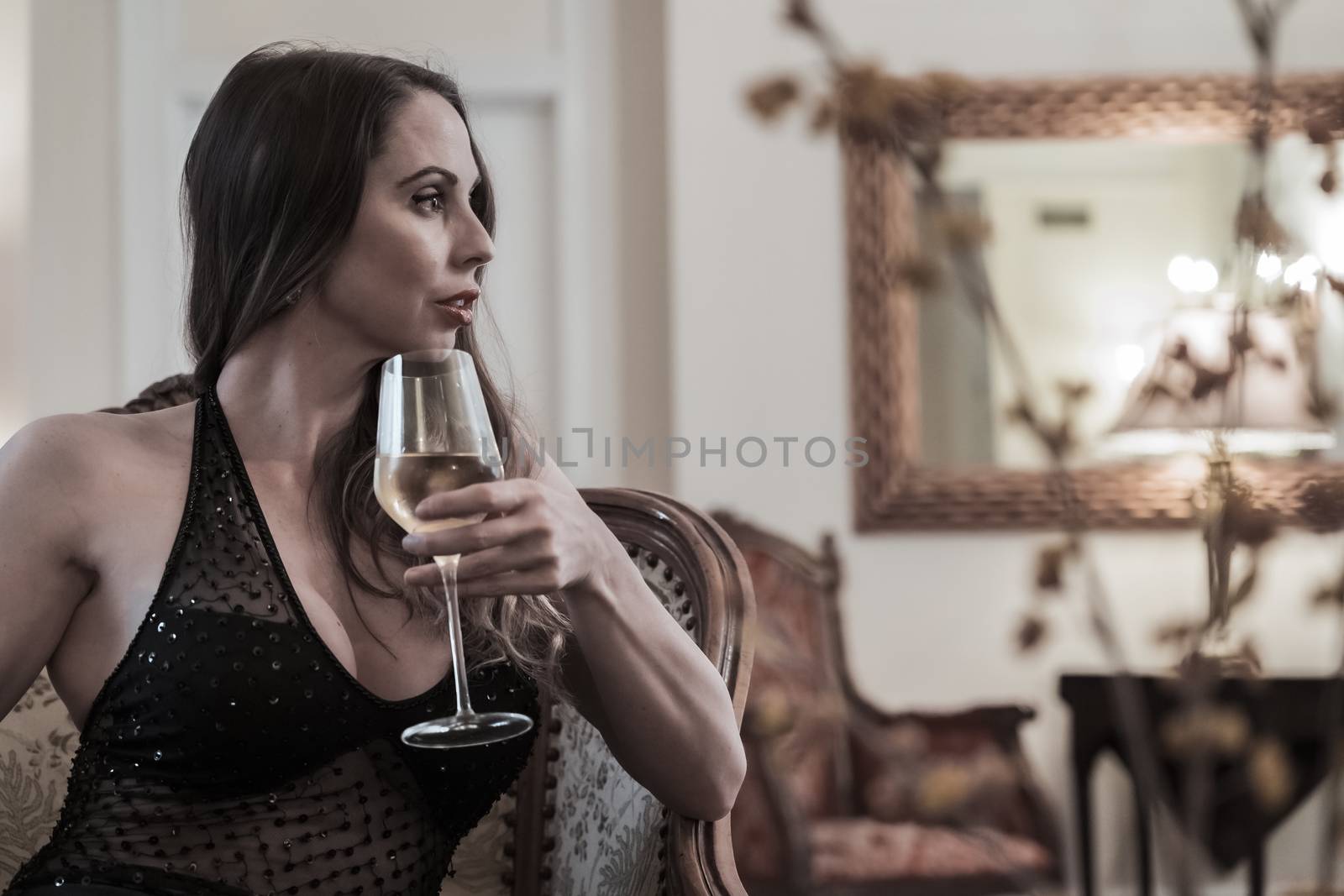 A Lovely Brunette Model Poses In A Red Dress In A Bedroom Environment by actionsports