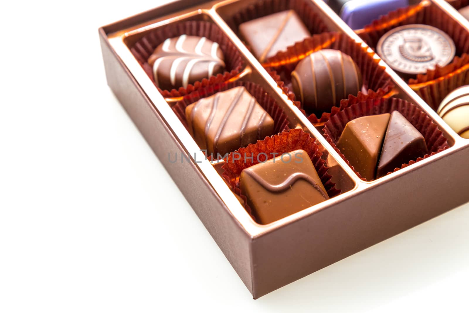 Assorted chocolates in brown box, with red heart chocolate