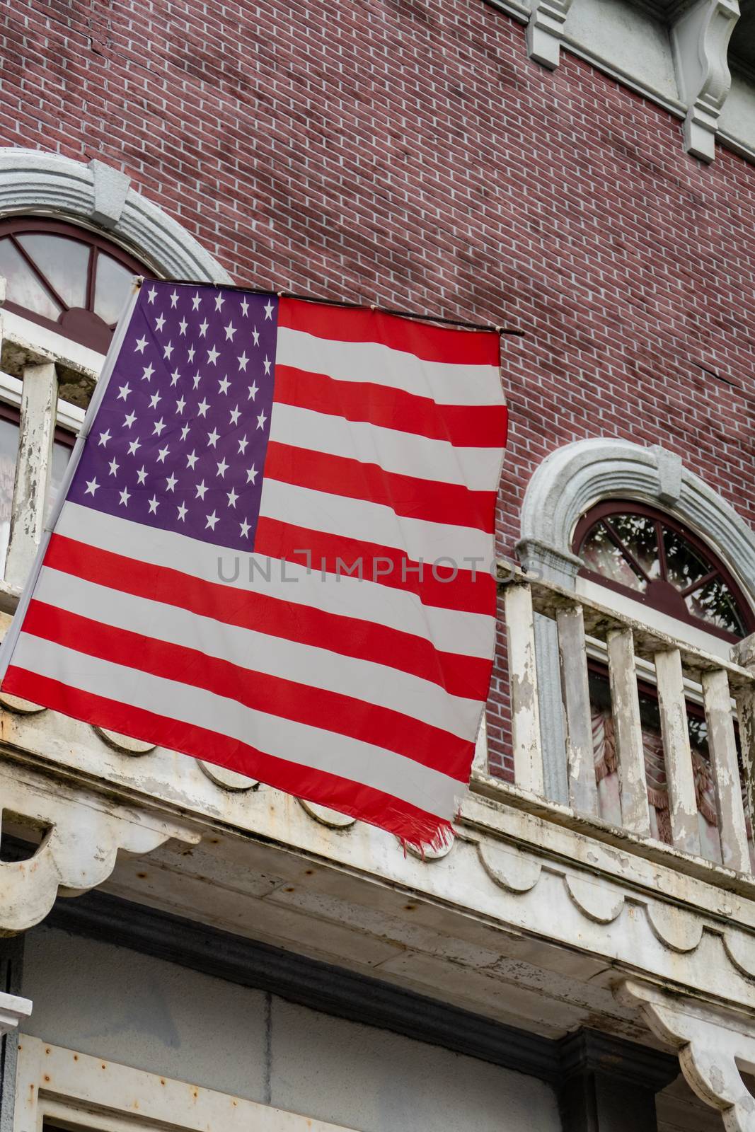 American flag in front of old style building by imagesbykenny