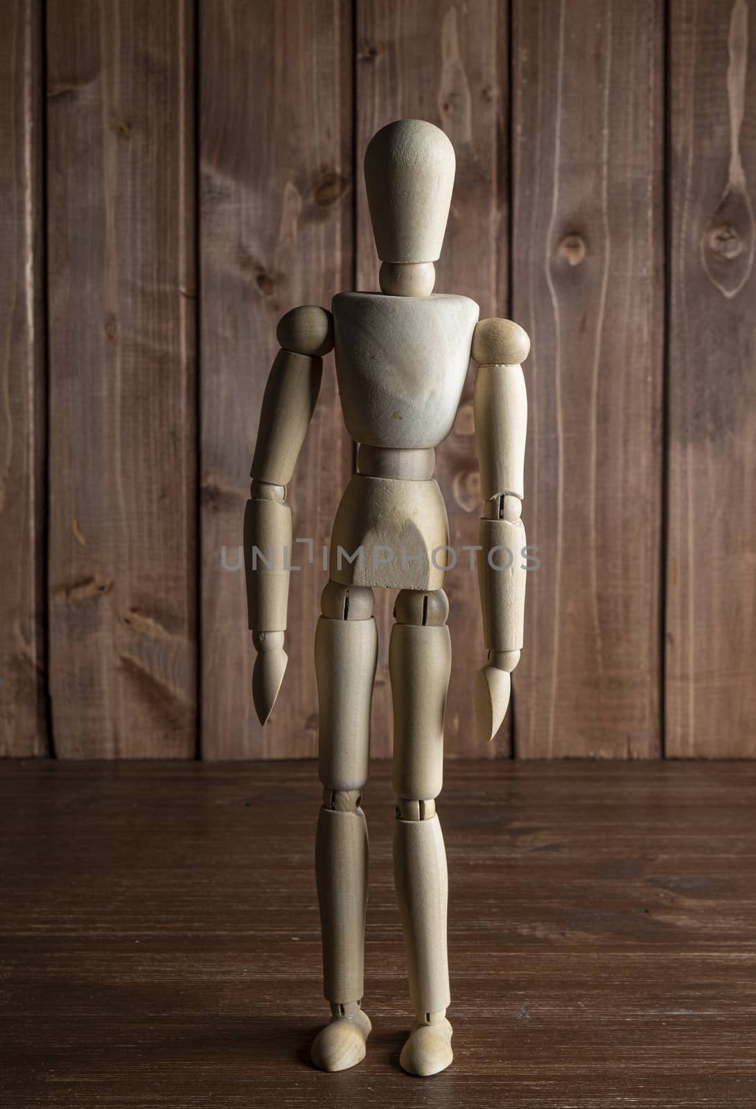 A mannequin on a wooden surface