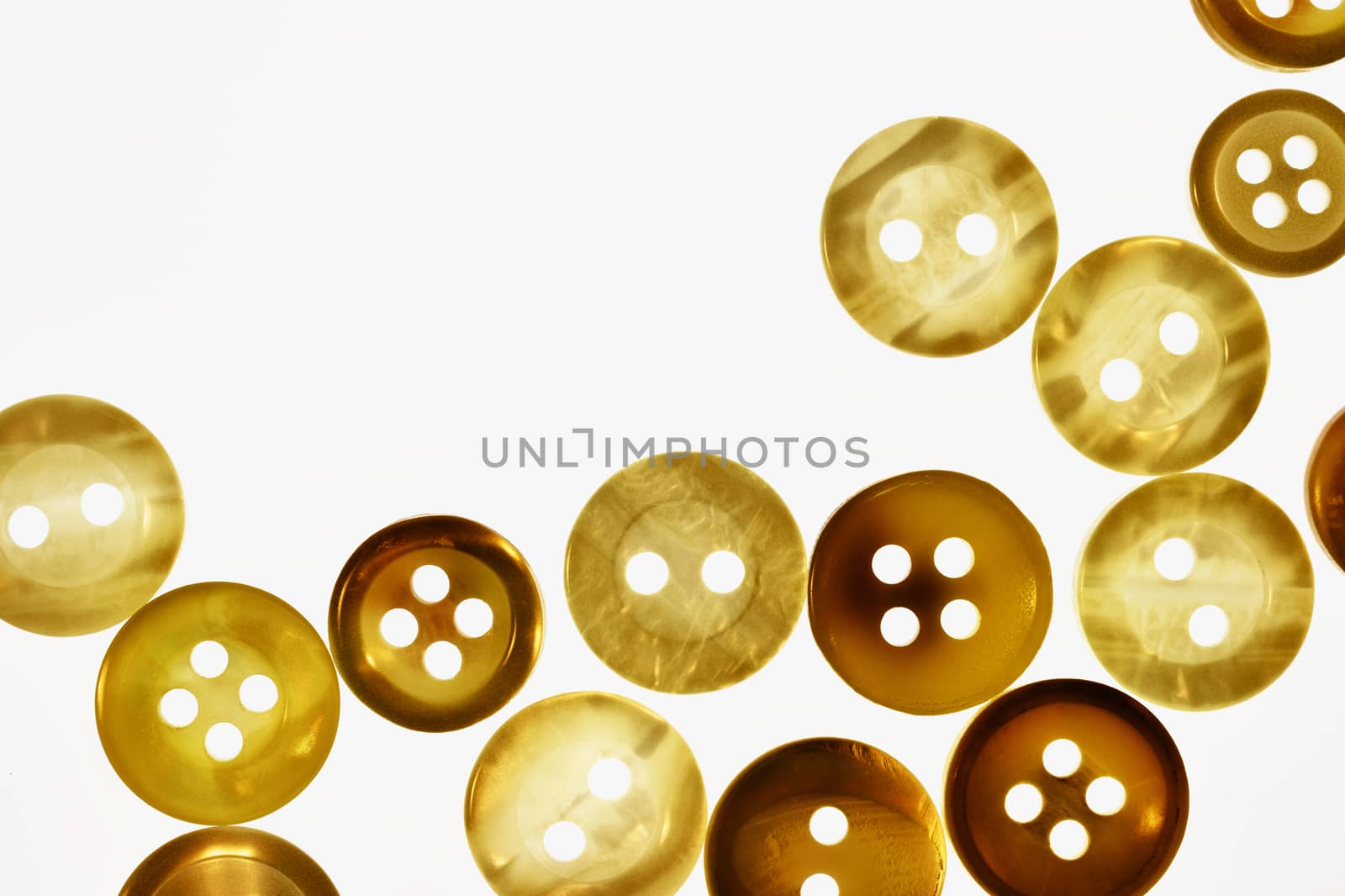Brown  buttons on white background , different size of bright round buttons 