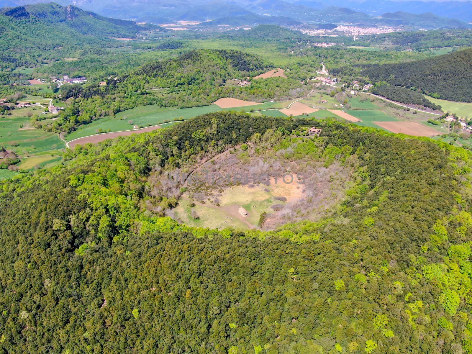 The Santa Margarida Volcano is an extinct volcano in the comarca of Garrotxa, Catalonia, Spain. The volcano has a perimeter of 2 km and a height of 682 meters in Garrotxa Volcanic Zone Natural Park