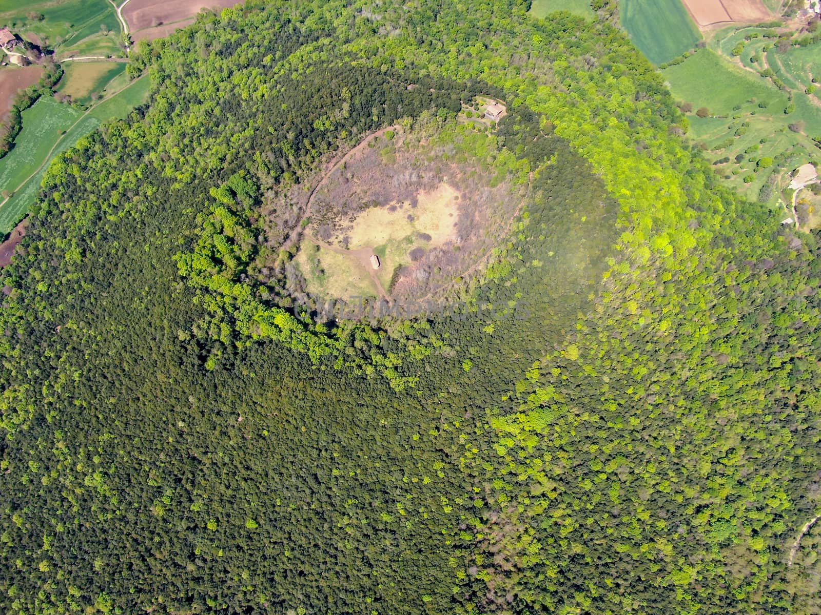 The Santa Margarida Volcano is an extinct volcano in the comarca of Garrotxa, Catalonia, Spain. The volcano has a perimeter of 2 km and a height of 682 meters in Garrotxa Volcanic Zone Natural Park